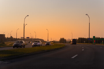 Evening view at sunset. Highway road in the countryside, roadside and asphalt