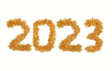 2023 Written with Corn Flakes or Maize Flakes Isolated on White Background, Happy New Year 2023 Wishing Conceptual Photo
