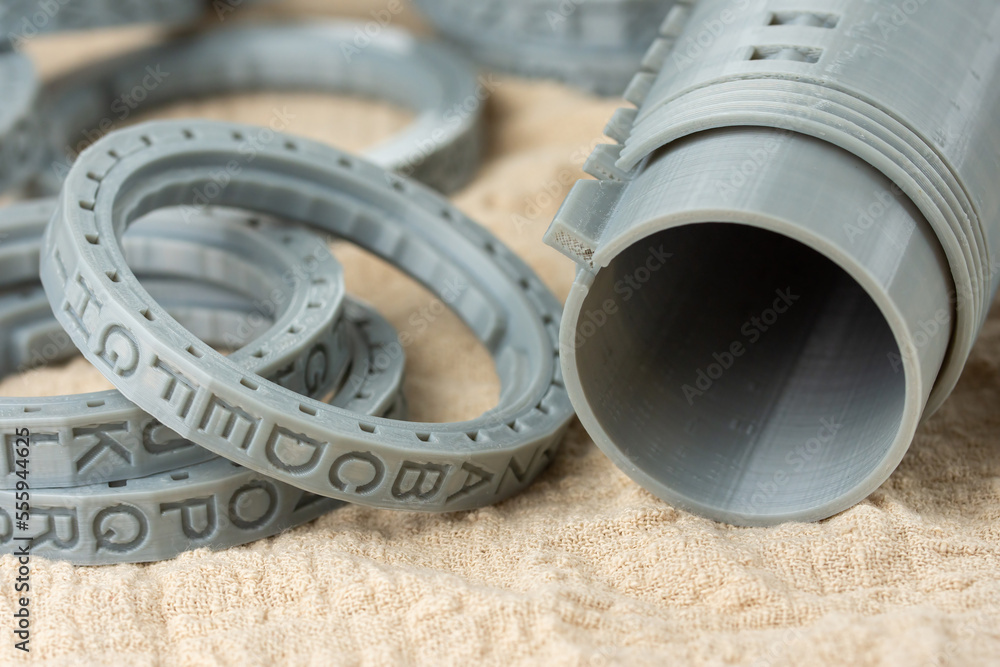 Poster close-up of plastic cryptex printed on a 3d printer. printed by fdm technology with gray filament.