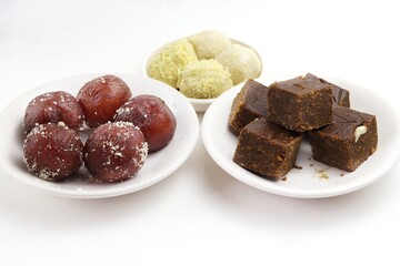 Closeup of Kala Jamun, Kheer Kadam or Raskadam Indian Sweets in Plates Isolated on White Background, Happy Diwali Festival Celebration Sweets