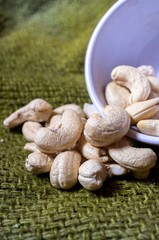 Closeup of Cashew Nut Isolated on Burlap Fabric
