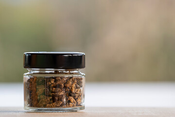 Jar of fried Crickets with copy space, alternative food with high protein