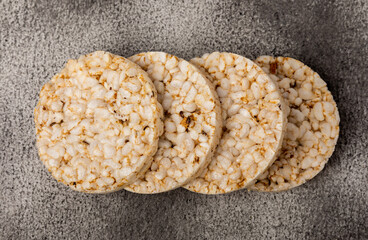Rice cakes on a textured table. Close-up. Healthy food. Diet food.Place for text.Space for copy.