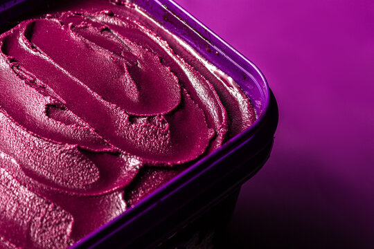 A&ccedil;a&iacute; pot over purple surface, traditional brazilian food.
