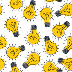 Hand drawn seamless pattern with randomly placed yellow light bulbs.