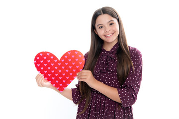 Young teenager child girl with heart shape. Happy Valentines Day. Love and pleasant feelings concept. Portrait of happy smiling teenage child girl.