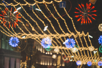 Colorful bokeh of street lights, Christmas decorations in glittering bokeh, Christmas street decoration lights in glittering bokeh