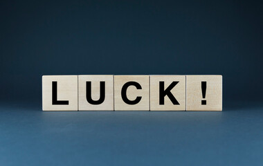 Luck. The cubes form the words Luck. The concept of wishing Luck