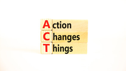 ACT action changes things symbol. Concept words ACT action changes things on wooden blocks on a beautiful white table white background. Business and ACT action changes things concept. Copy space.