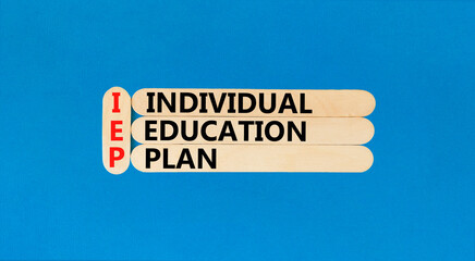 IEP individual education plan symbol. Concept words IEP individual education plan on wooden sticks on beautiful blue table blue background. Business IEP individual education plan concept. Copy space.