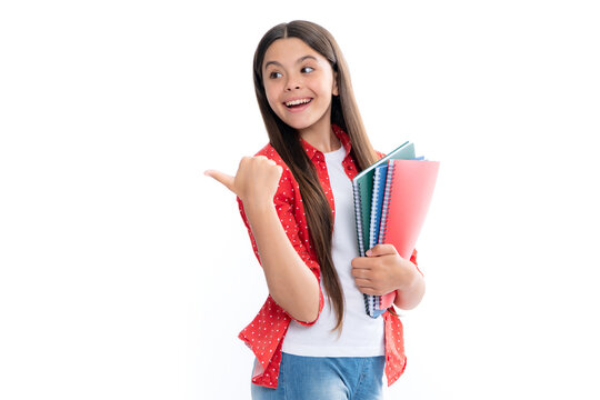 Teen girl pupil hold books, notebooks, isolated on white background, copy space. Back to school, teenage lifestyle, education and knowledge. Portrait of happy smiling teenage child girl.