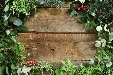 Christmas background. Frame made of Christmas greenery twigs.