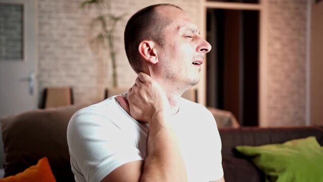 Man feels neck pain after woke up in morning, uncomfortable matrass, closeup