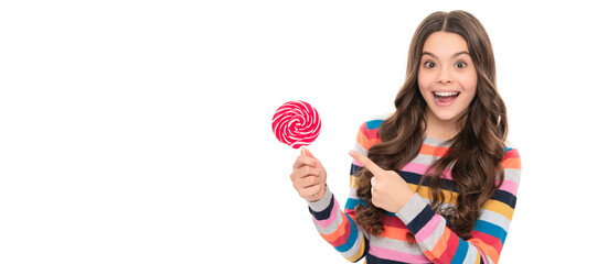 look there. yummy. amazed girl pointing finger on lollipop. lollipop child. Teenager child with...