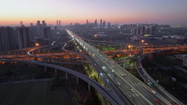 Aerial top view photo of highway multilevel junction road in urban at night