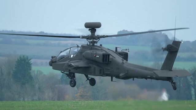 British army Boeing Apache Attack helicopter gunship AH-64E AH64E ZM722 ArmyAir606, in a 2m static hover, Wiltshire UK