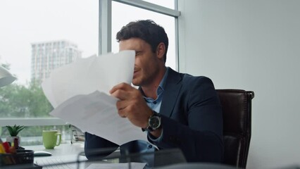 Mad businessman talking phone throwing documents. Upset manager arguing on call - Powered by Adobe