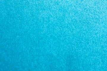 macro photography of blue  spray paint on white paper