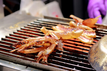 Merchants grilling octopus on the grill