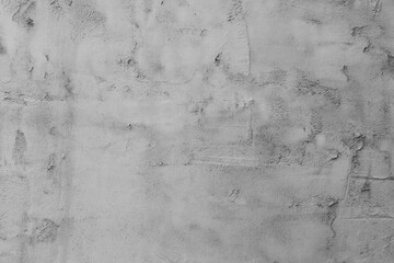 Abstract background from a wall covered with gray plaster.