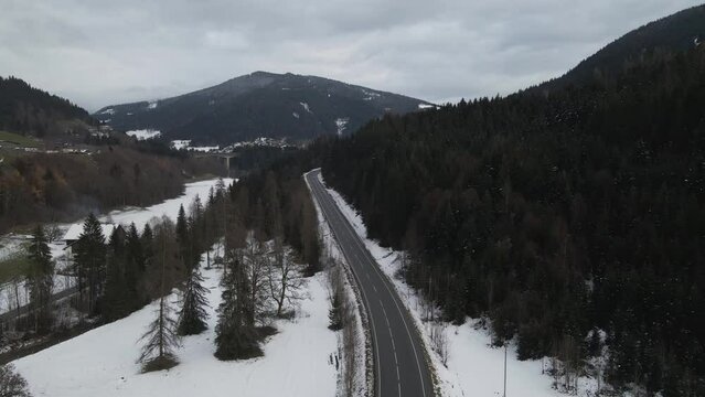 Aerial view of a winter mountain landscape with snow in Eben Im Pongau, Salzburg, Austria.
