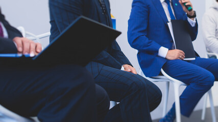 Audience at the conference hall listens to lecturer, people on a congress together listen to...