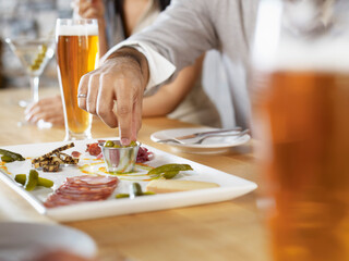 Group of People Eating Appetizers at Wine Bar, Toronto, Ontario, Canada