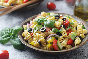 A bowl with traditional Italian pasta salad
