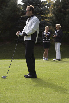 People Golfing
