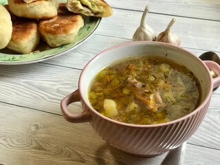Buckwheat soup with meat and pies with garlic are prepared for lunch or breakfast