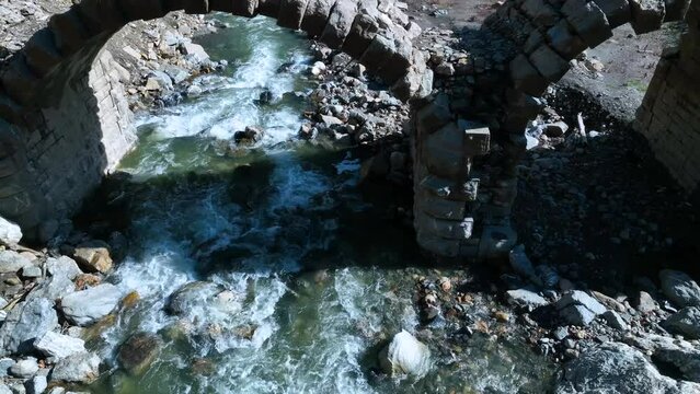 Roman bridge and sunken town of Saqu&eacute;s in the Bubal reservoir. Aerial view from a drone. Jaca Stone. Biescas Municipality. The Jacetania. Huesca, Aragon, Spain, Europe