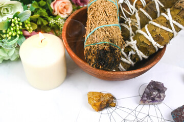 Close up of burning white sage with crystals healing on Merkaba, Metatron’s Cube sacred geometry...