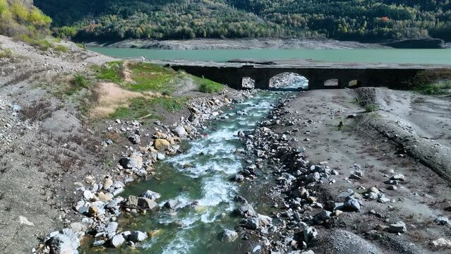 Roman bridge and sunken town of Saqu&eacute;s in the Bubal reservoir. Aerial view from a drone. Jaca Stone. Biescas Municipality. The Jacetania. Huesca, Aragon, Spain, Europe