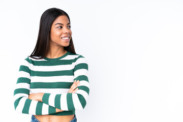 Fototapeta premium Young African American woman isolated on white background with arms crossed and happy