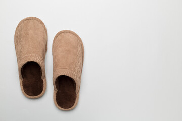 Man's slippers on color background, top view