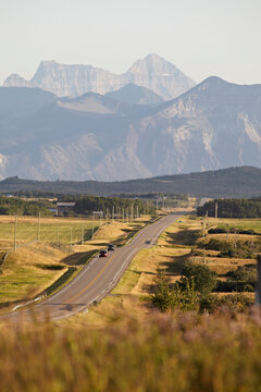 Rural Road and Rocky Mountains, Pincher Creek, Alberta, Canada