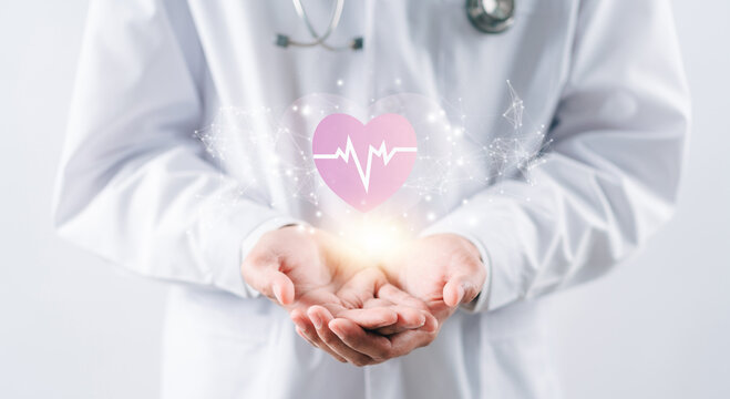 Doctor in white coat holding heartbeat icon for positive healthcare insurance symbol concept, Mental health care, medical check up, heart attack, cardiology, help from specialist concept.