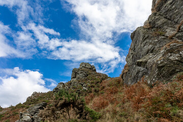 Fototapeta na wymiar clouds over the mountain, cliff, rocks, sunny, mountain