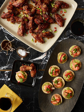 Overhead View of Appetizers, Chicken Wings and Crostini, Studio Shot