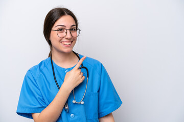 surgeon doctor woman holding tools isolated on white background pointing to the side to present a product