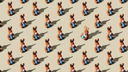 Pattern of soft toy bunny on brown pastel background