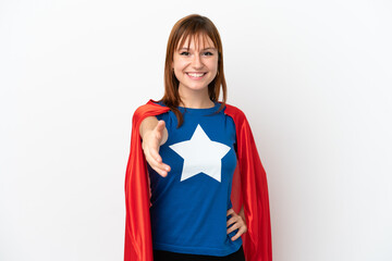 Redhead girl isolated on white background in superhero costume and making a deal © luismolinero