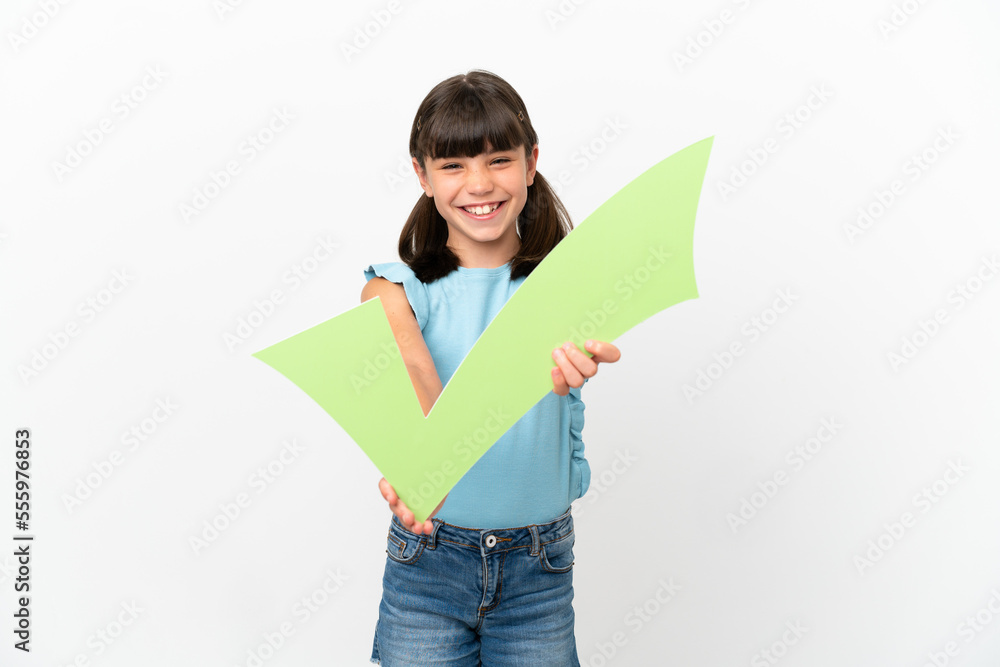 Wall mural Little caucasian kid isolated on white background holding a check icon with happy expression