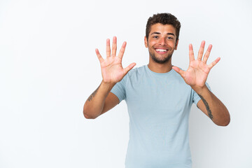 Fototapeta premium Young handsome Brazilian man isolated on white background counting ten with fingers