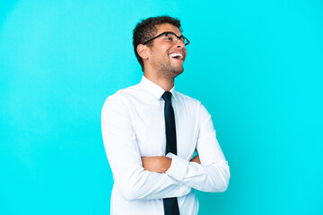 Young business Brazilian man isolated on blue background happy and smiling