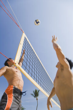 Two Men Playing Volleyball
