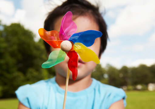 Little Boy Holding a Pinwheel