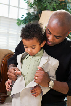 Father Helping Son Button Suit Jacket, Getting Ready for Church