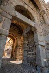 Fototapeta na wymiar Stone entrance in the wall of the monumental city of Toledo, Spain