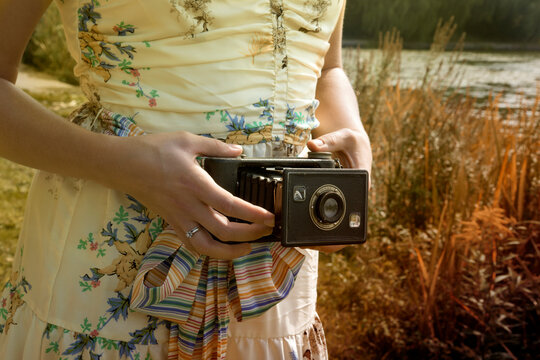 Woman Holding Folding Camera, High Park, Toronto, Ontario, Canada